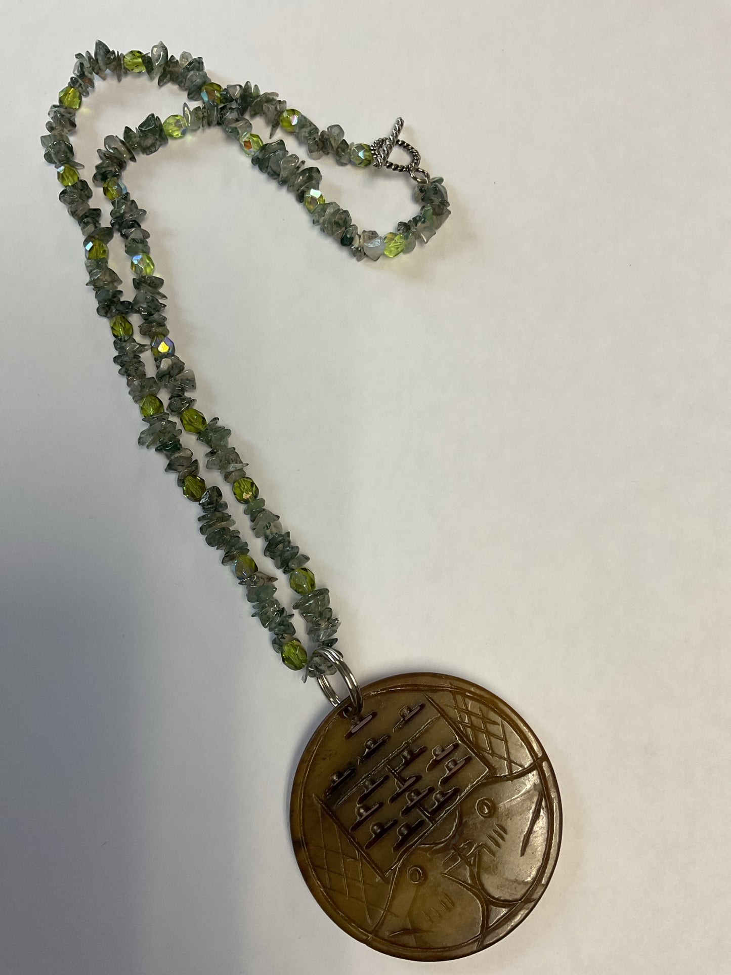 Necklace blue green stones with large round bird pendant