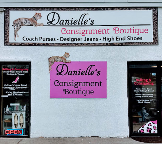 Exterior storefront of Danielle’s Consignment Boutique, a fashion consignment shop specializing in designer jeans, handbags, and high-end shoes.