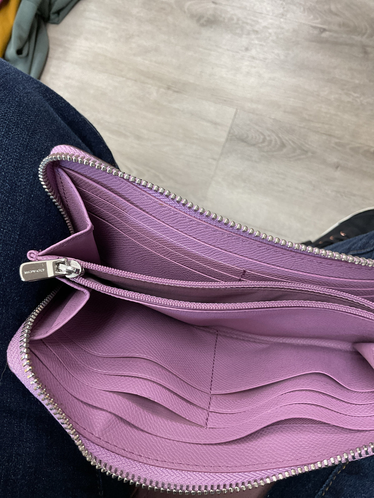 coach Wallet metallic pink full size zip around ink spot on back