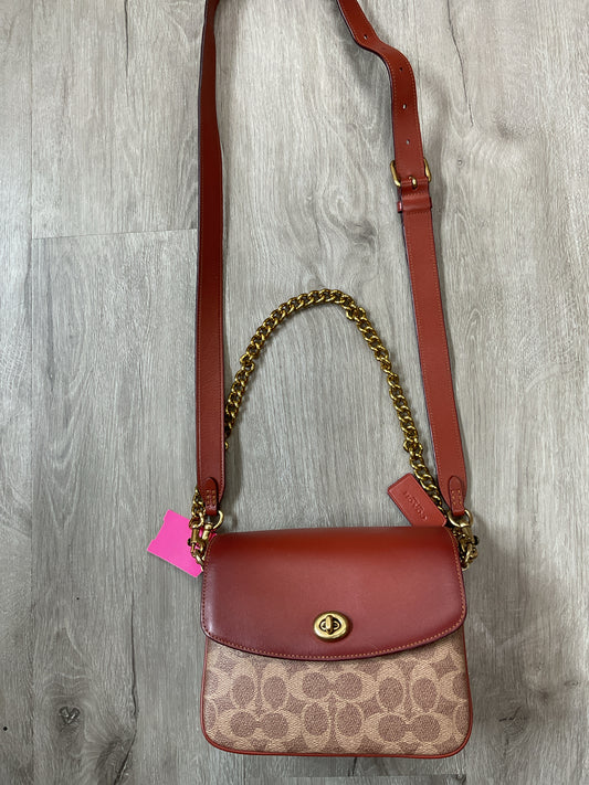 coach Purse Cassie Crossbody 19 in signiture canvas rust turn lock