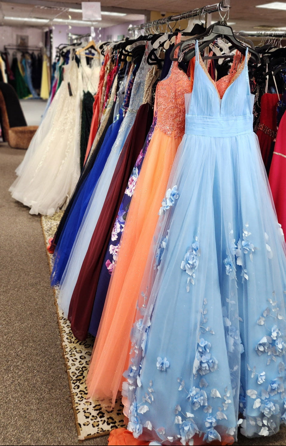 A beautiful selection of prom and formal dresses in various colors at Danielle’s Consignment Boutique.